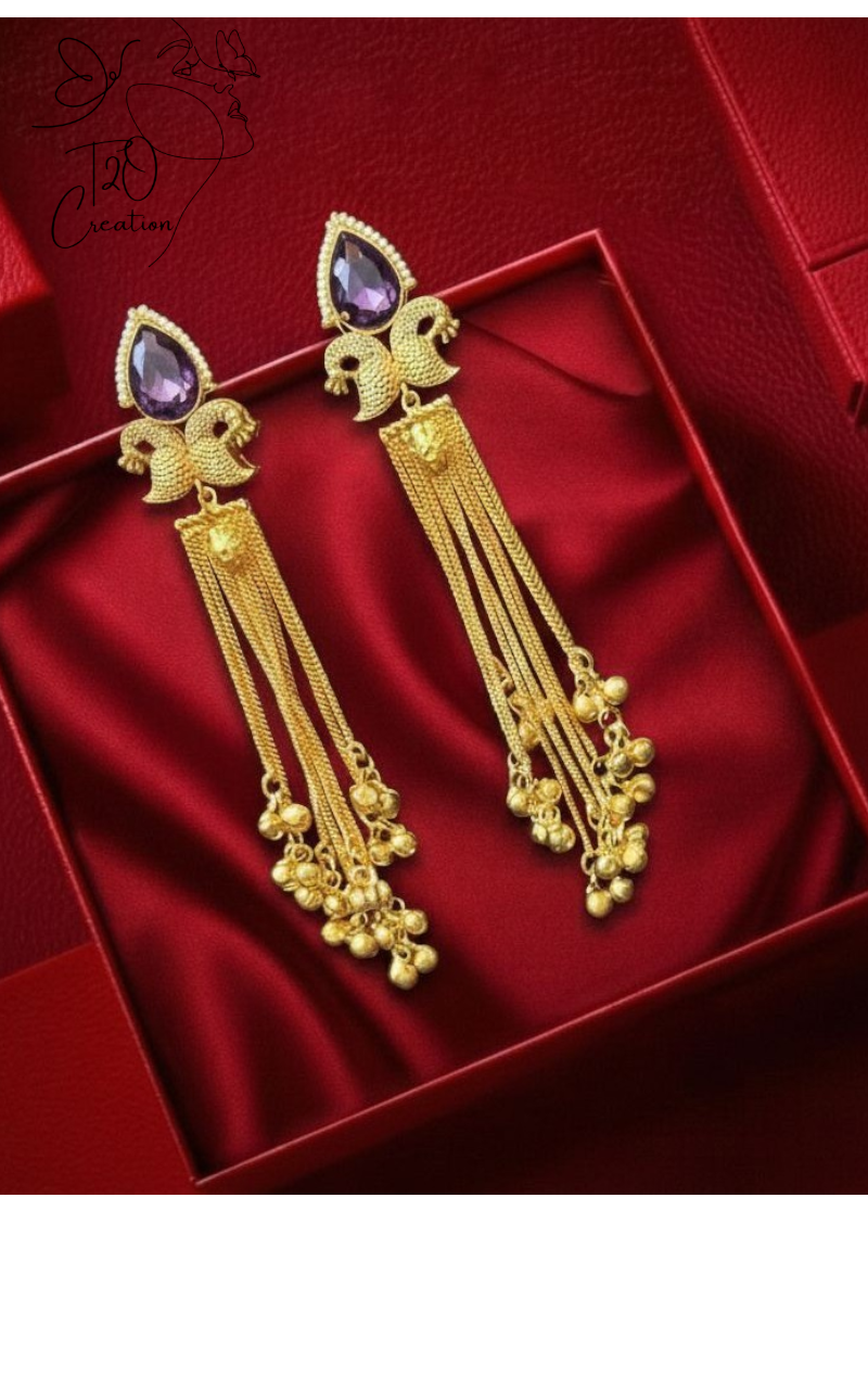 Gold earrings with purple stones on a red satin background