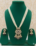 Jewelry set with necklace and earrings on a green mannequin